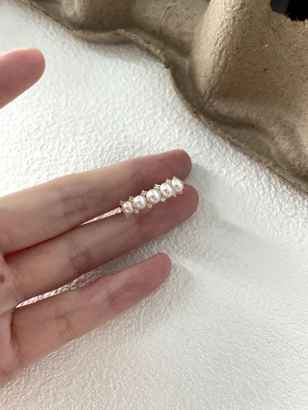 Crown-shaped diamond and pearl ring