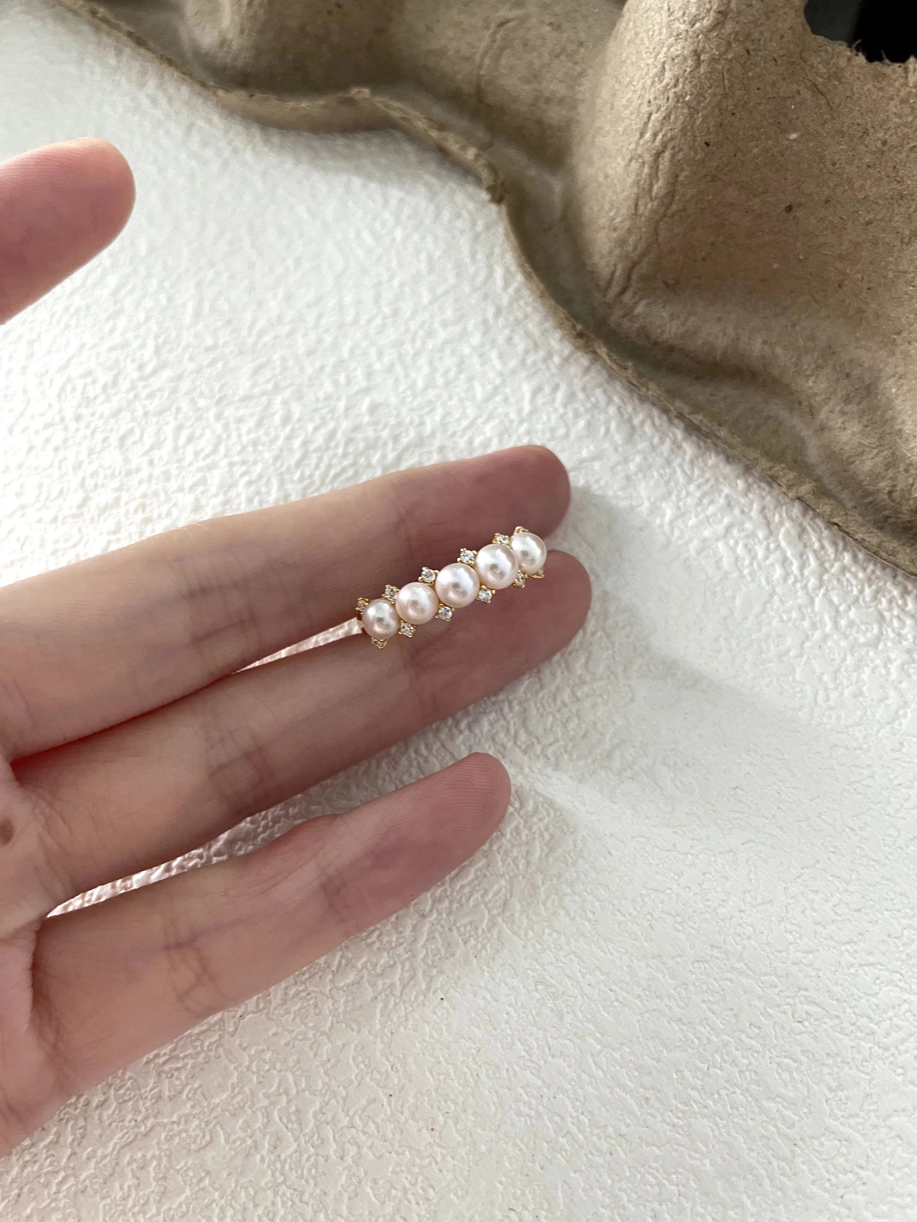 Crown-shaped diamond and pearl ring