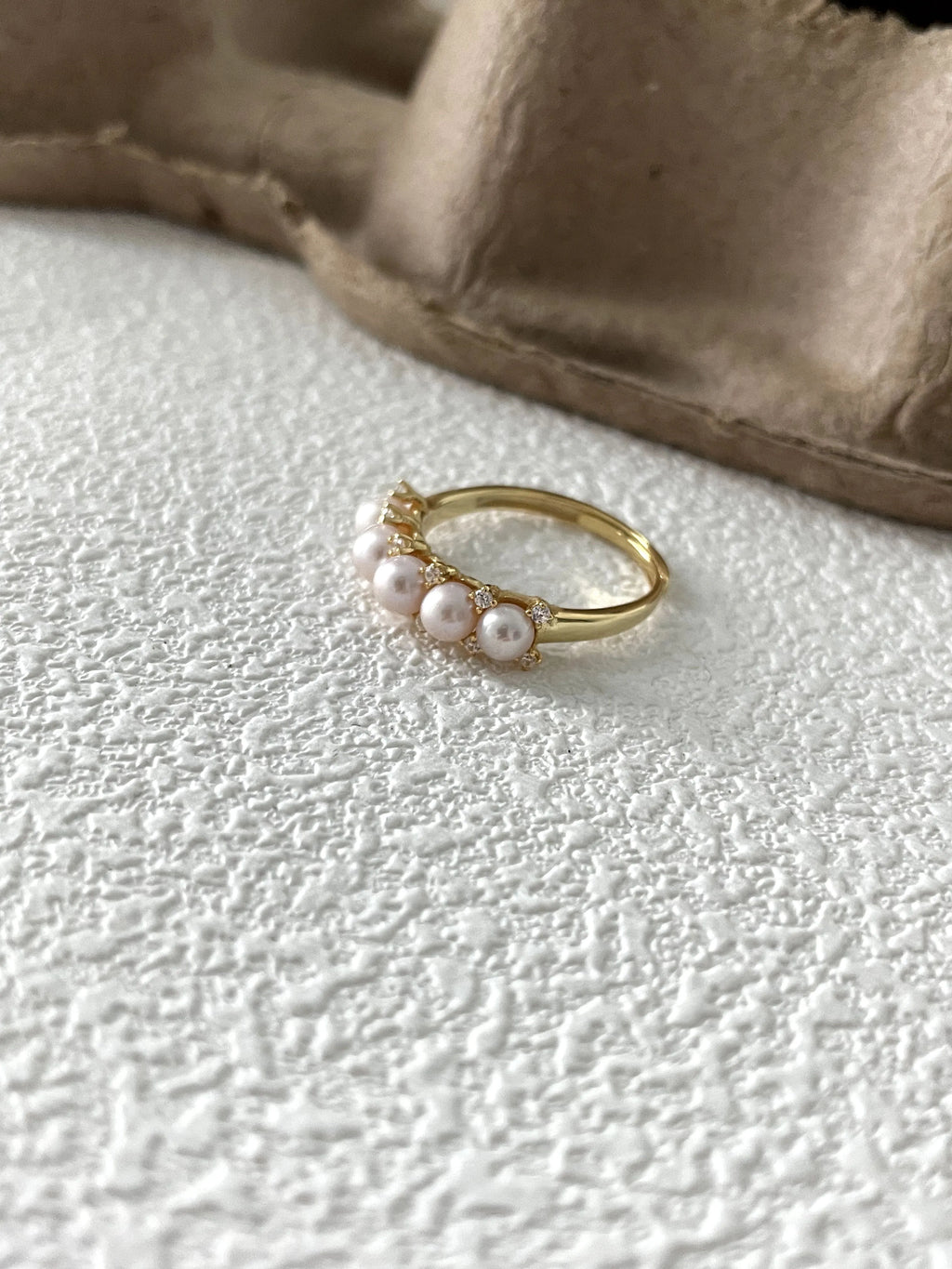 Crown-shaped diamond and pearl ring