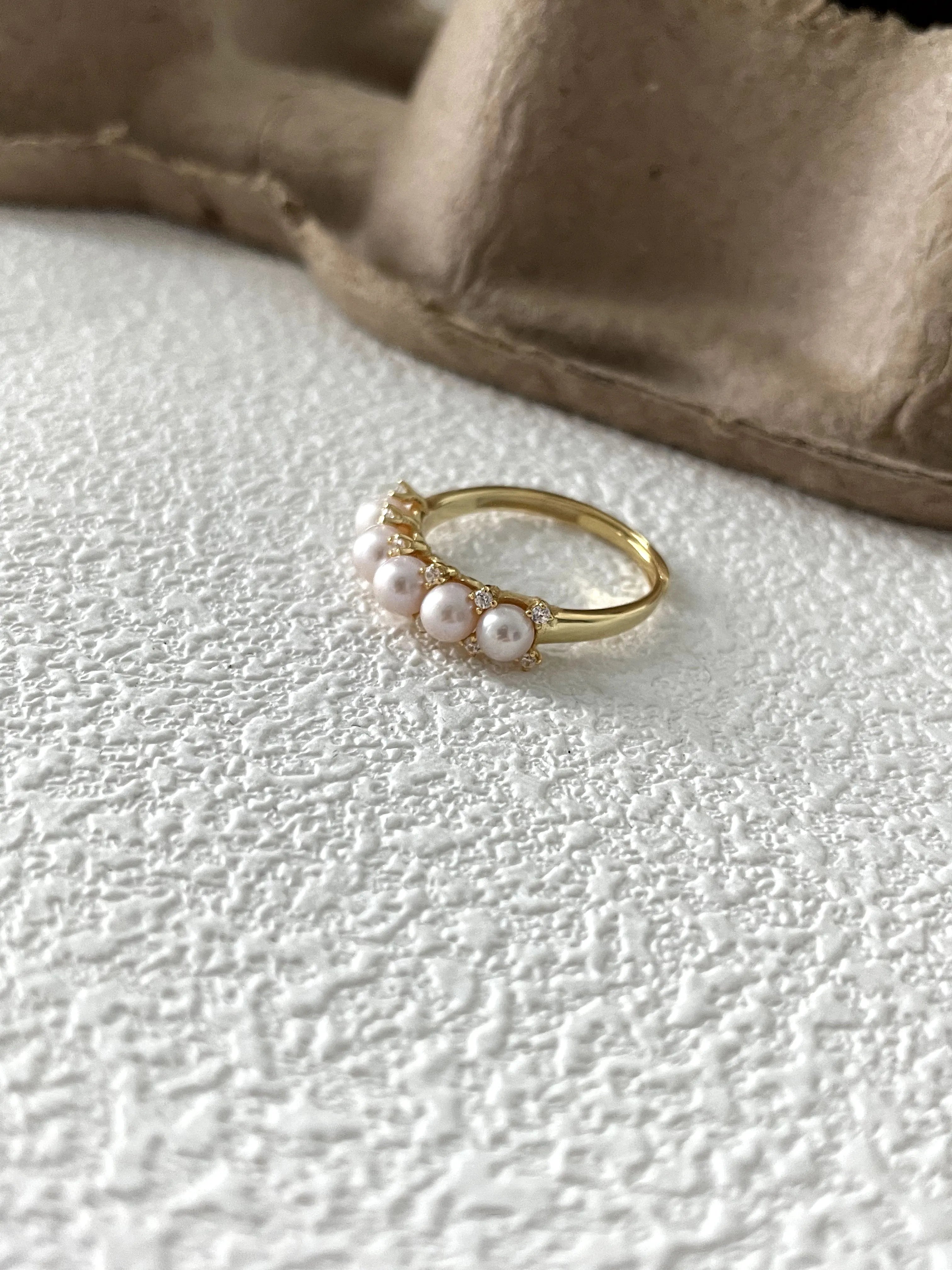 Crown-shaped diamond and pearl ring