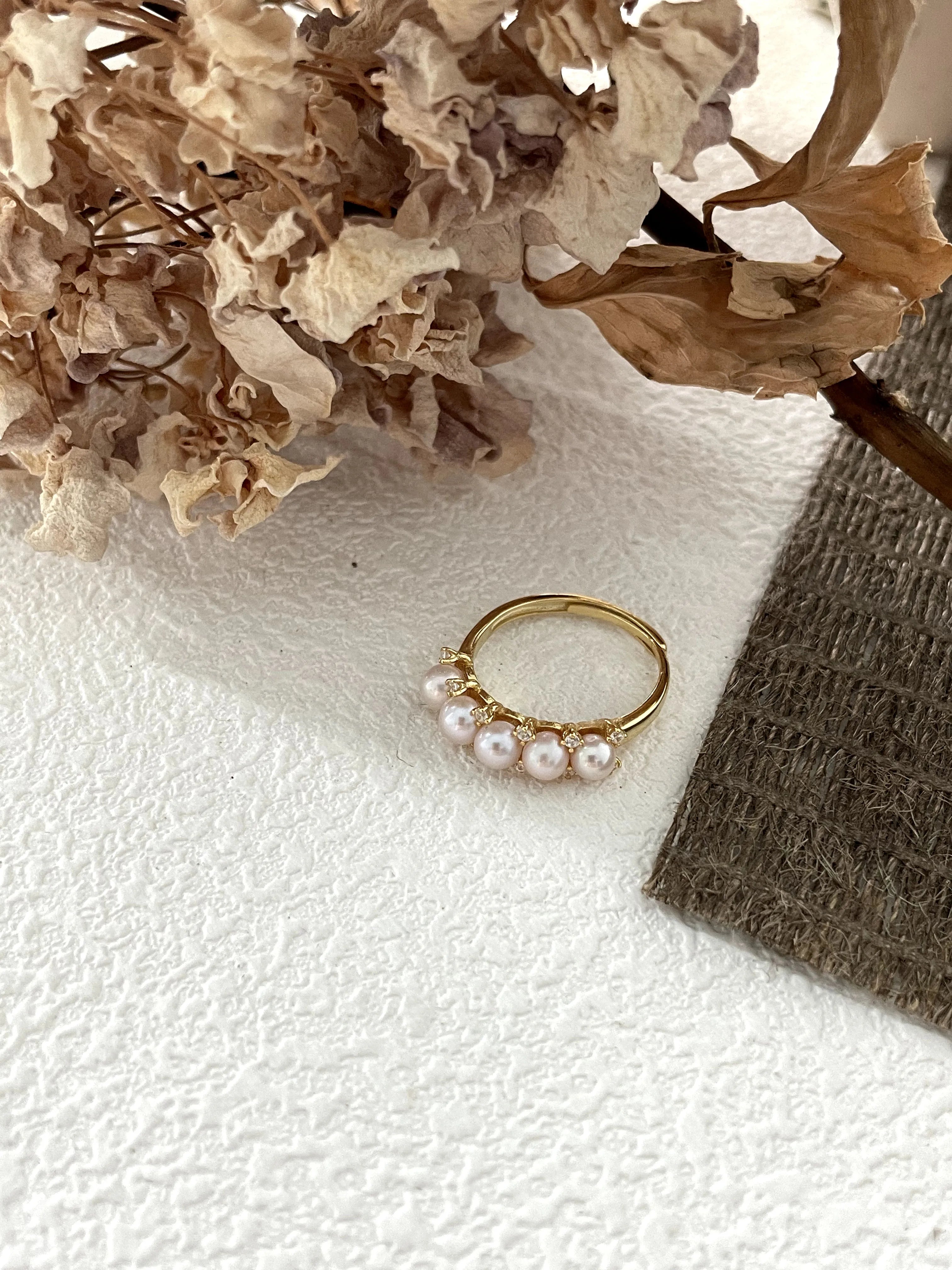 Crown-shaped diamond and pearl ring